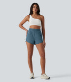 Short de yoga 7,5 cm taille haute à ourlet arrondi et poches