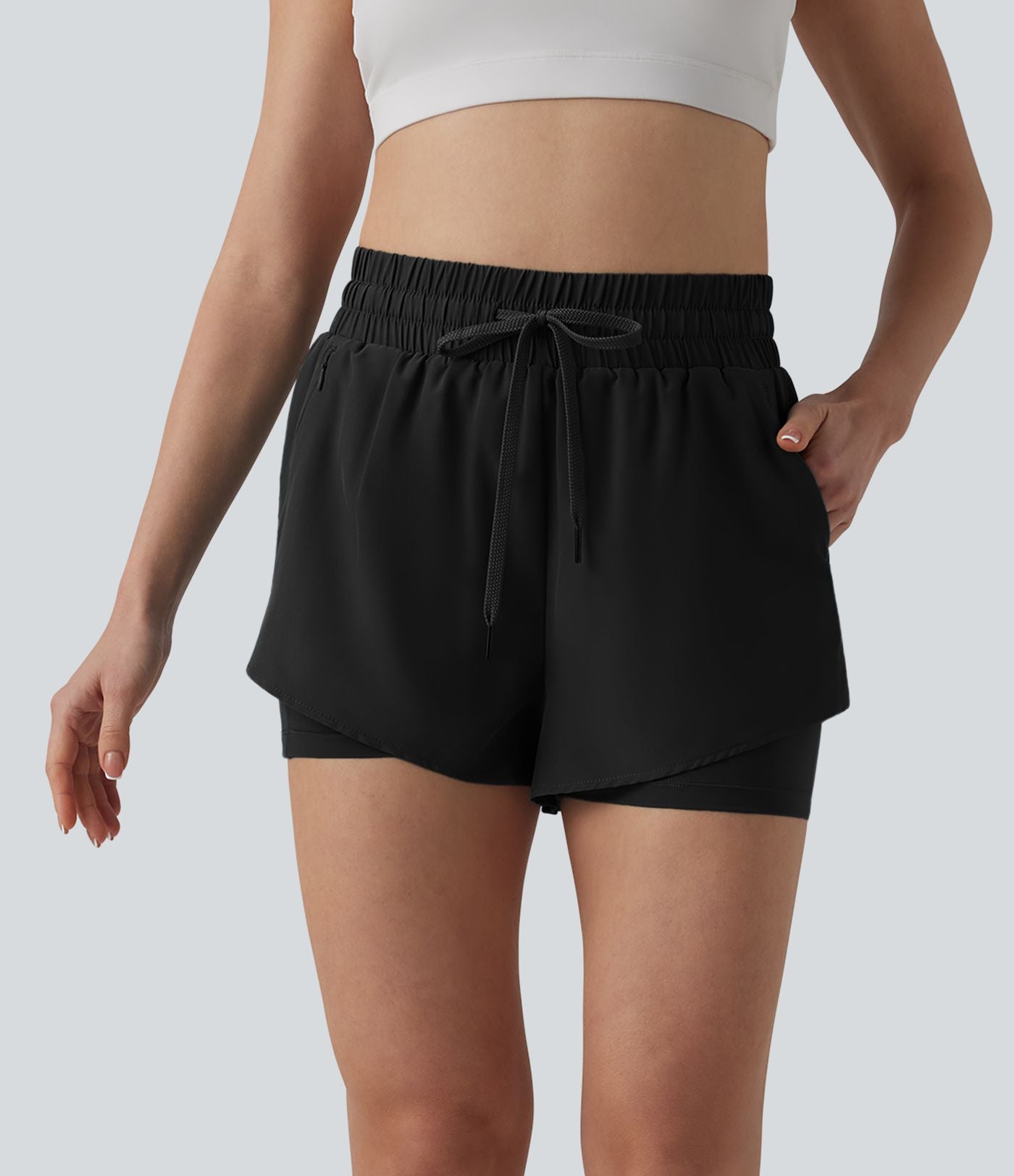 Short running 2-en-1 taille haute avec cordon de serrage et poches