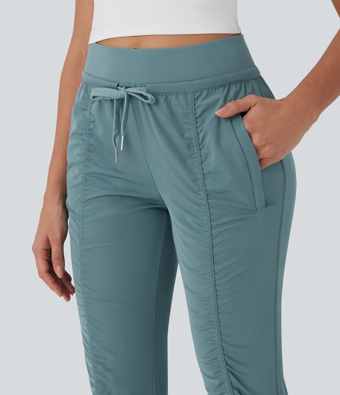 Pantalon jogging de voyage taille haute avec cordon de serrage, coupe fuselée et poches latérales zippées
