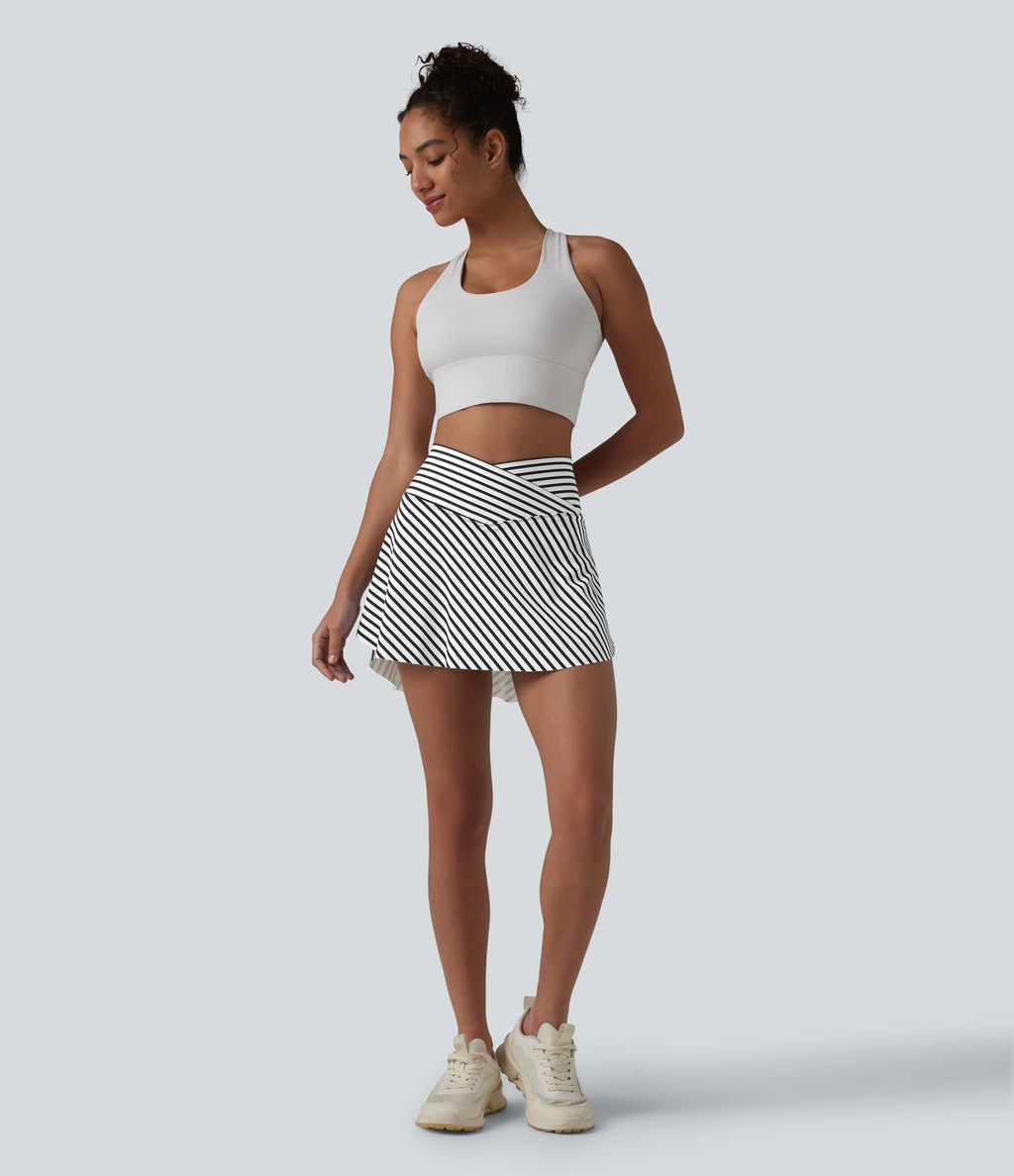 Jupe de tennis mini 2 en 1 à rayures, taille haute croisée, ourlet arrondi et poches