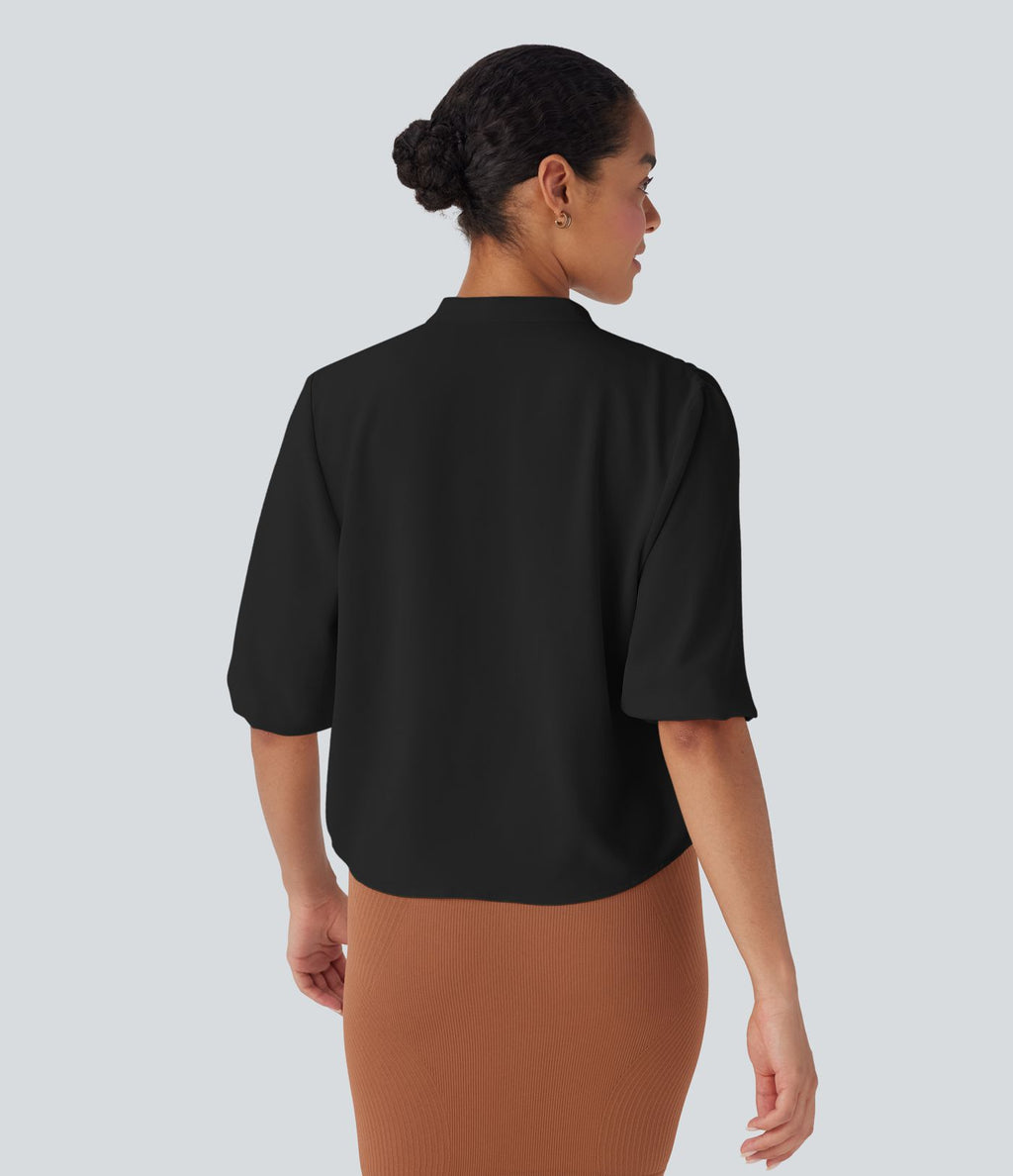 Blouse aspect lin col rond, manches mi-longues, boutonnée avec ourlet arrondi pour la détente