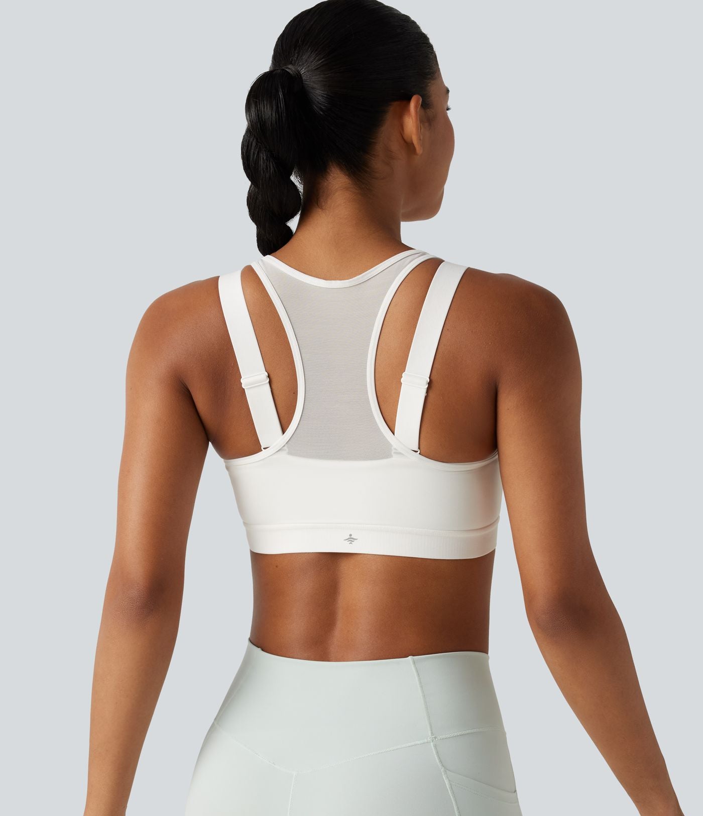 Brassière de sport d'entraînement maintien moyen col rond échancré dos nageur avec fermeture éclair, mesh contrasté et coussinets non amovibles