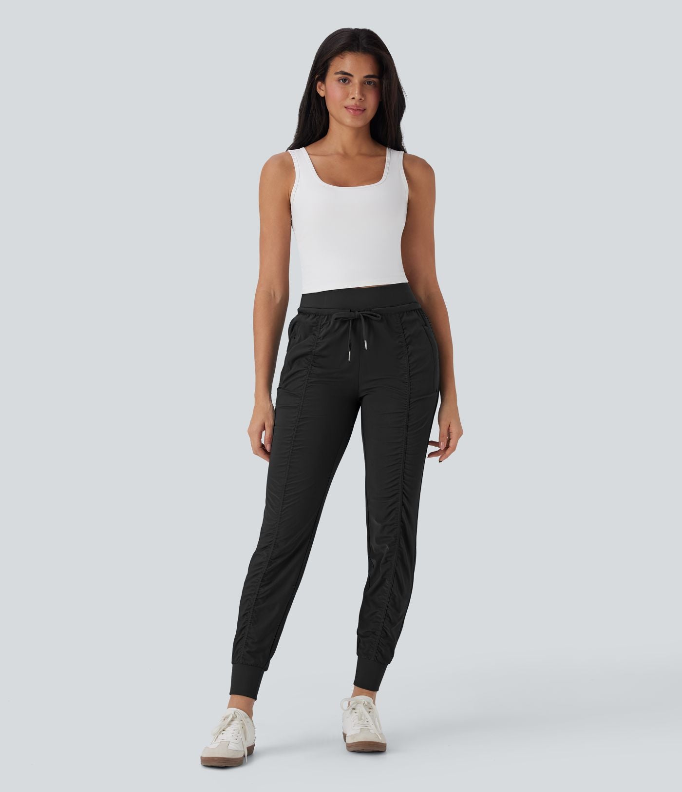 Pantalon jogging de voyage taille haute avec cordon de serrage, coupe fuselée et poches latérales zippées