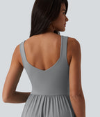 Robe midi fluide sans manches dos croisé, avec brassière intégrée (Bonnets E-G) et poches
