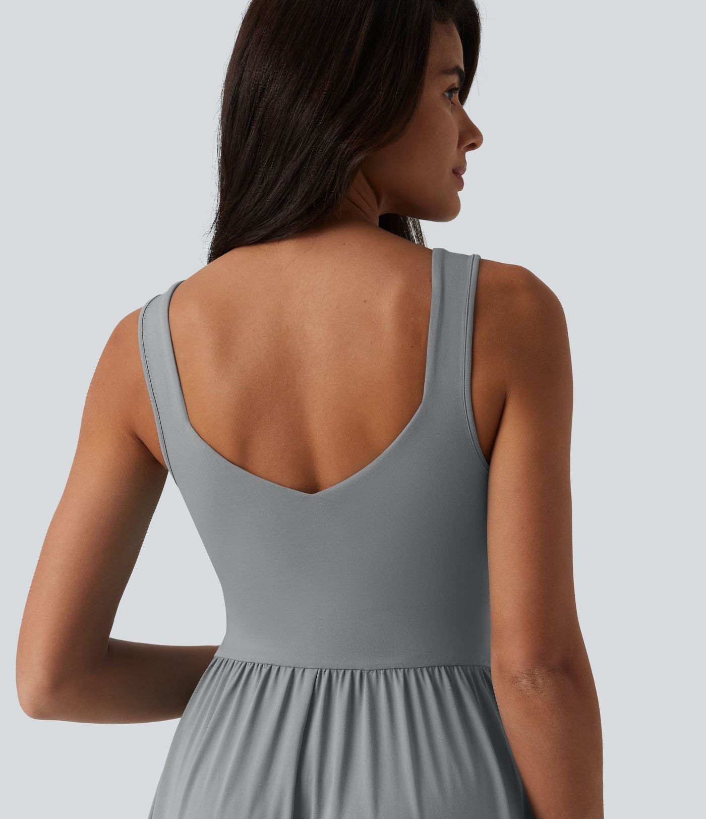 Robe midi fluide sans manches dos croisé, avec brassière intégrée (Bonnets E-G) et poches