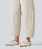 Pantalon décontracté à taille mi-haute, coupe ample et jambes fuselées, avec poches