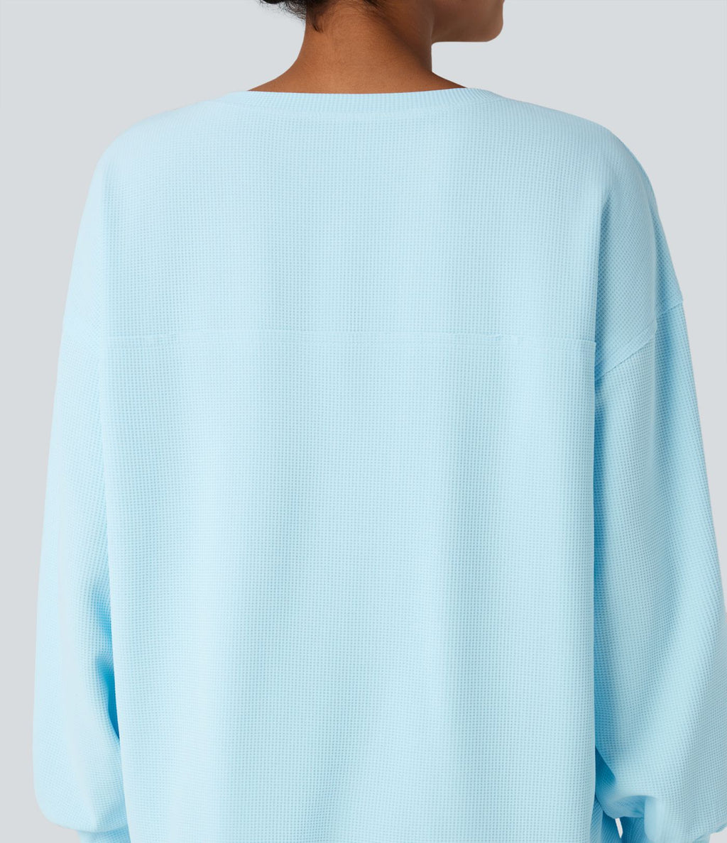 Sweat-shirt gaufré henley oversize manches longues avec poches
