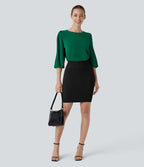 Blouse de travail col bateau avec manches évêque et dos ajouré
