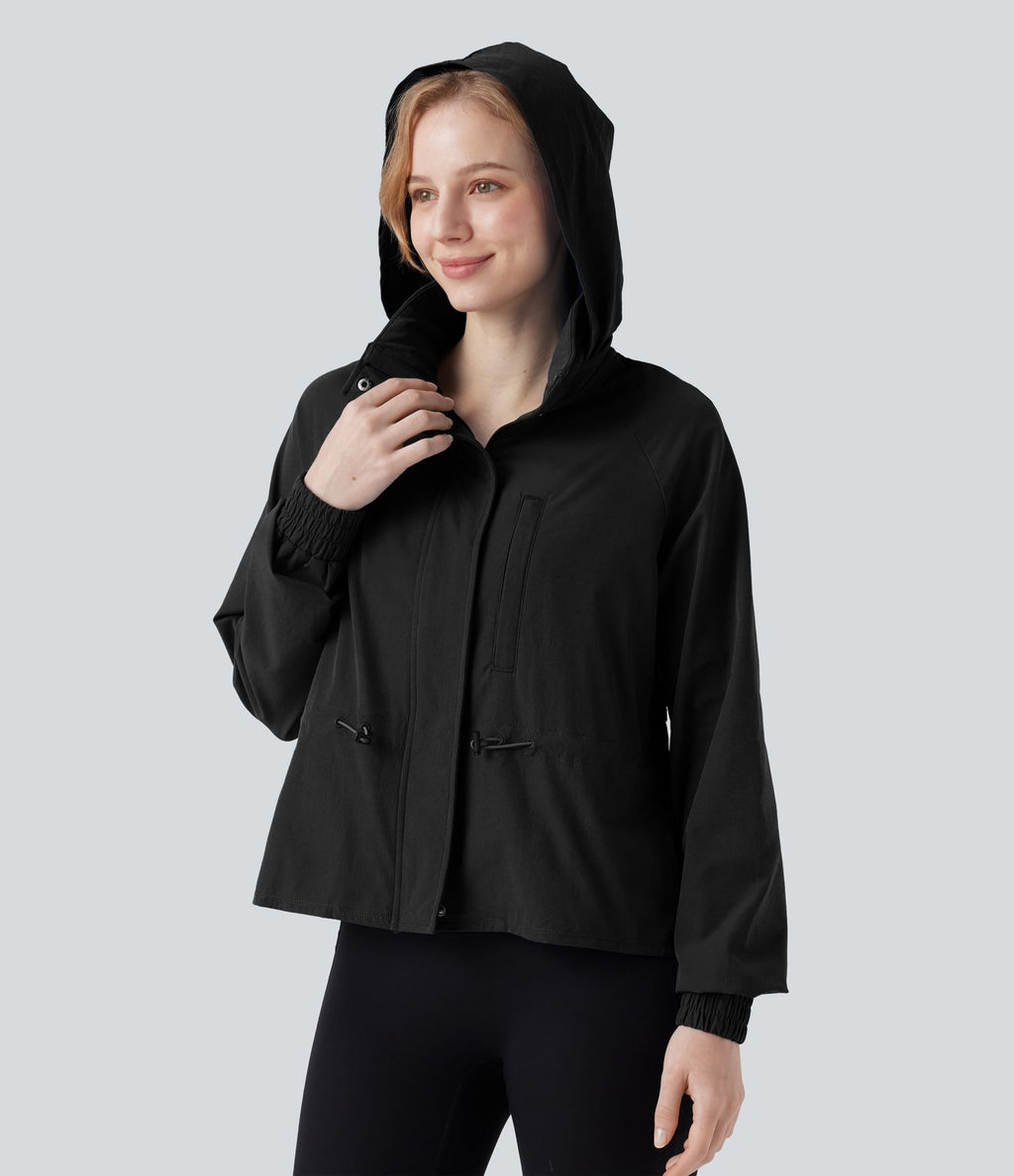 Veste cape d'entraînement à capuche amovible avec cordon de serrage, mesh contrastant et ourlet à volants avec poche