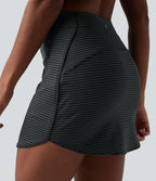 Jupe de golf mini moulante 2-en-1 taille haute à rayures avec poches