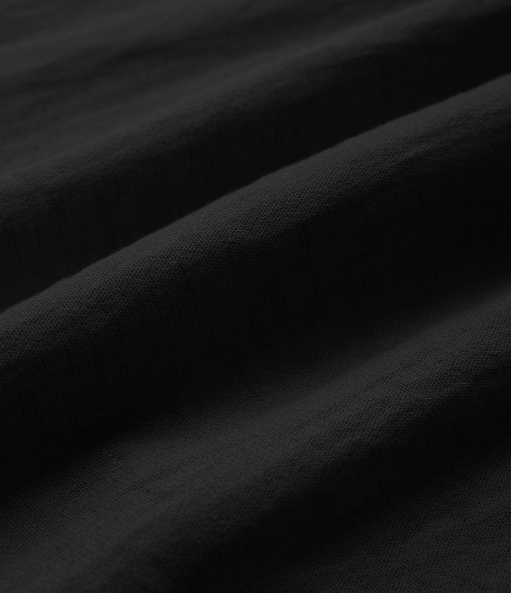 Chemise décontractée à manches courtes avec col et ourlet arrondi, aspect lin