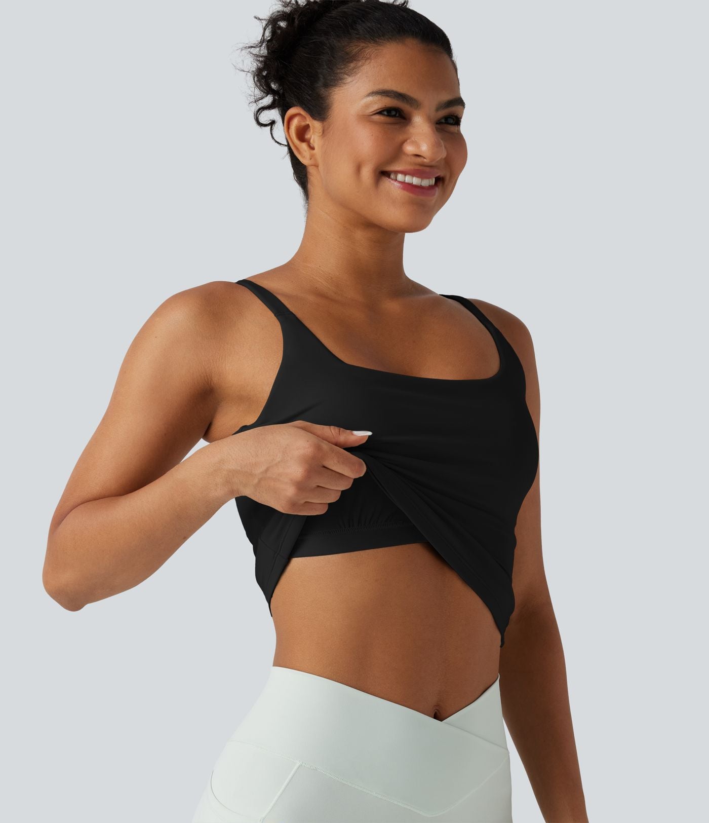 Débardeur de sport effet lissant sous les bras avec dos en V et brassière intégrée