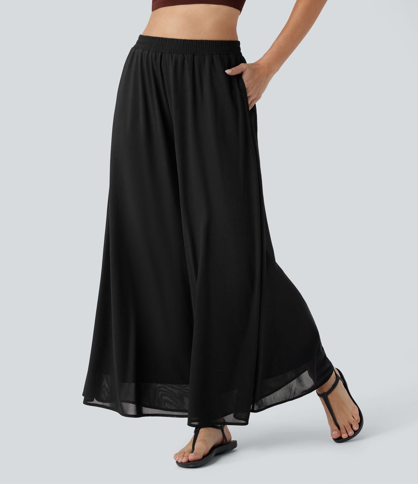 Pantalon fluide et ample avec superposition en mesh, poches latérales et taille haute