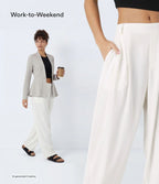 Pantalon tailleur ample, taille moyenne, coupe barrel, à poches