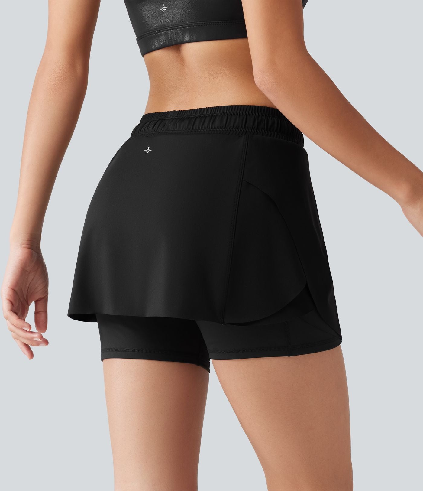 Jupe-short de sport mini SoftlyZero™ Airy taille mi-haute à ourlet croisé, toucher frais, cordon ajustable et poches