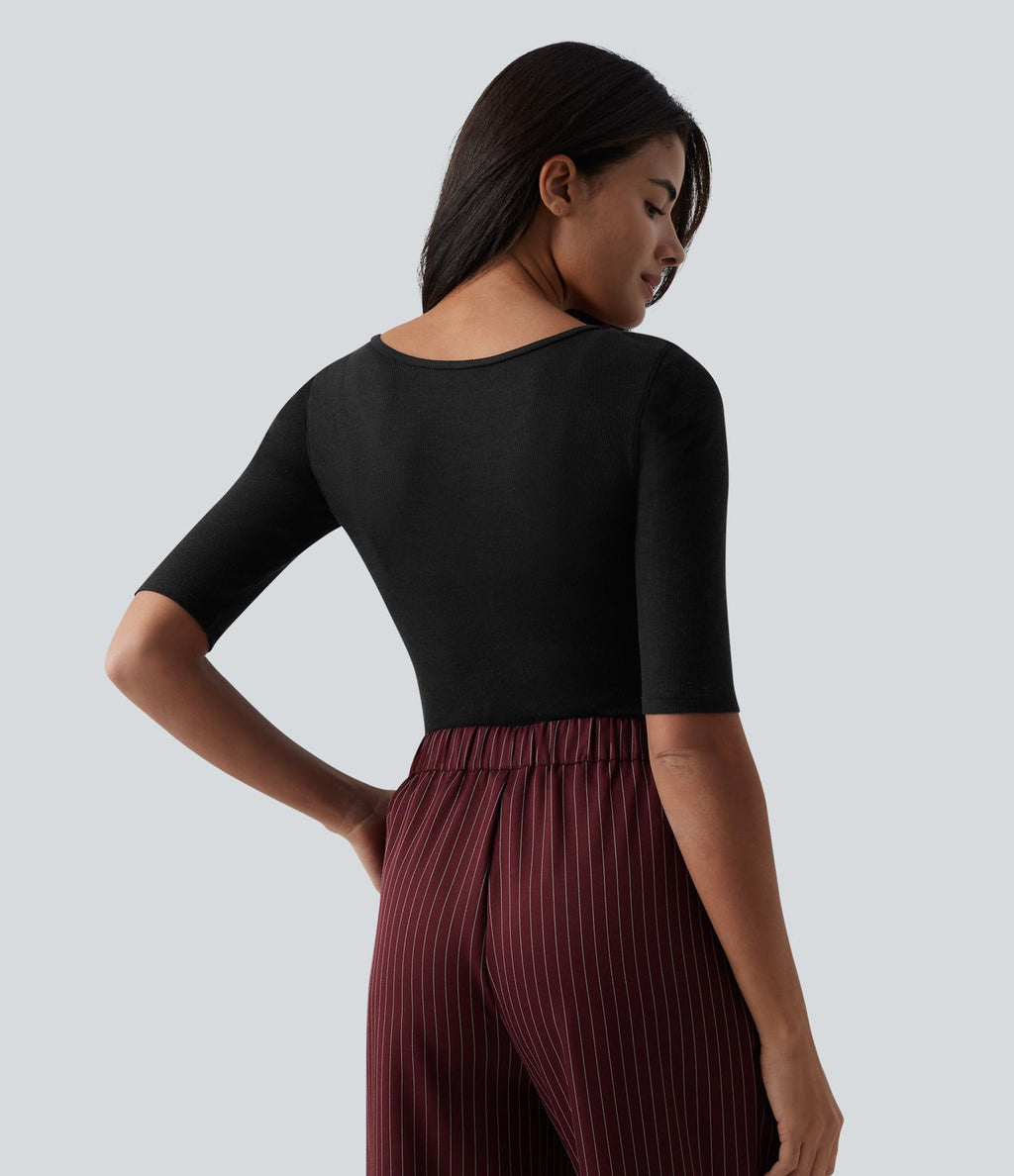 Top tailleur en mélange de laine col rond échancré à manches courtes en maille côtelée