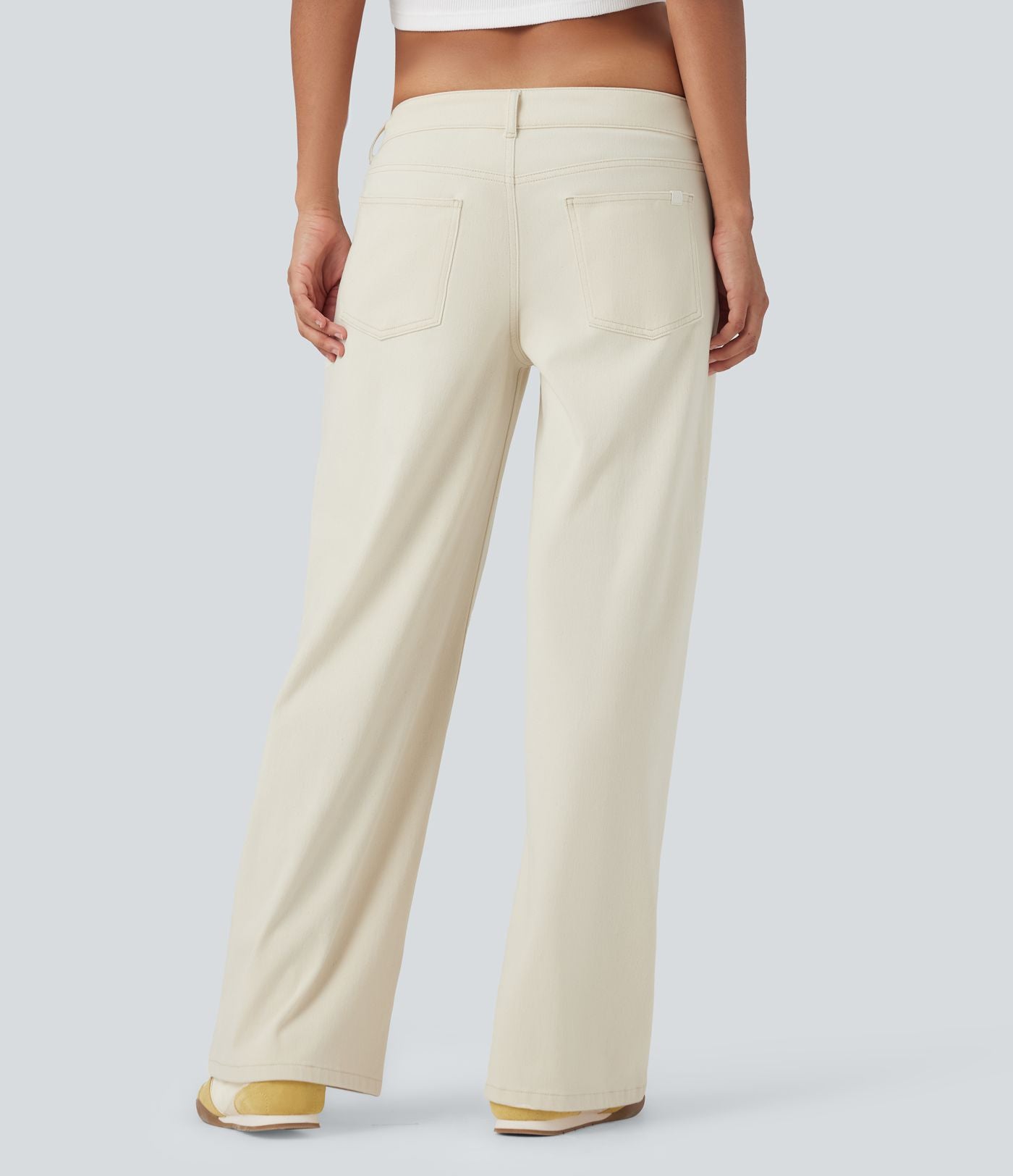 Halara Flex™ Jean large asymétrique taille basse avec bouton, fermeture éclair et poches multiples, délavé et extensible en maille