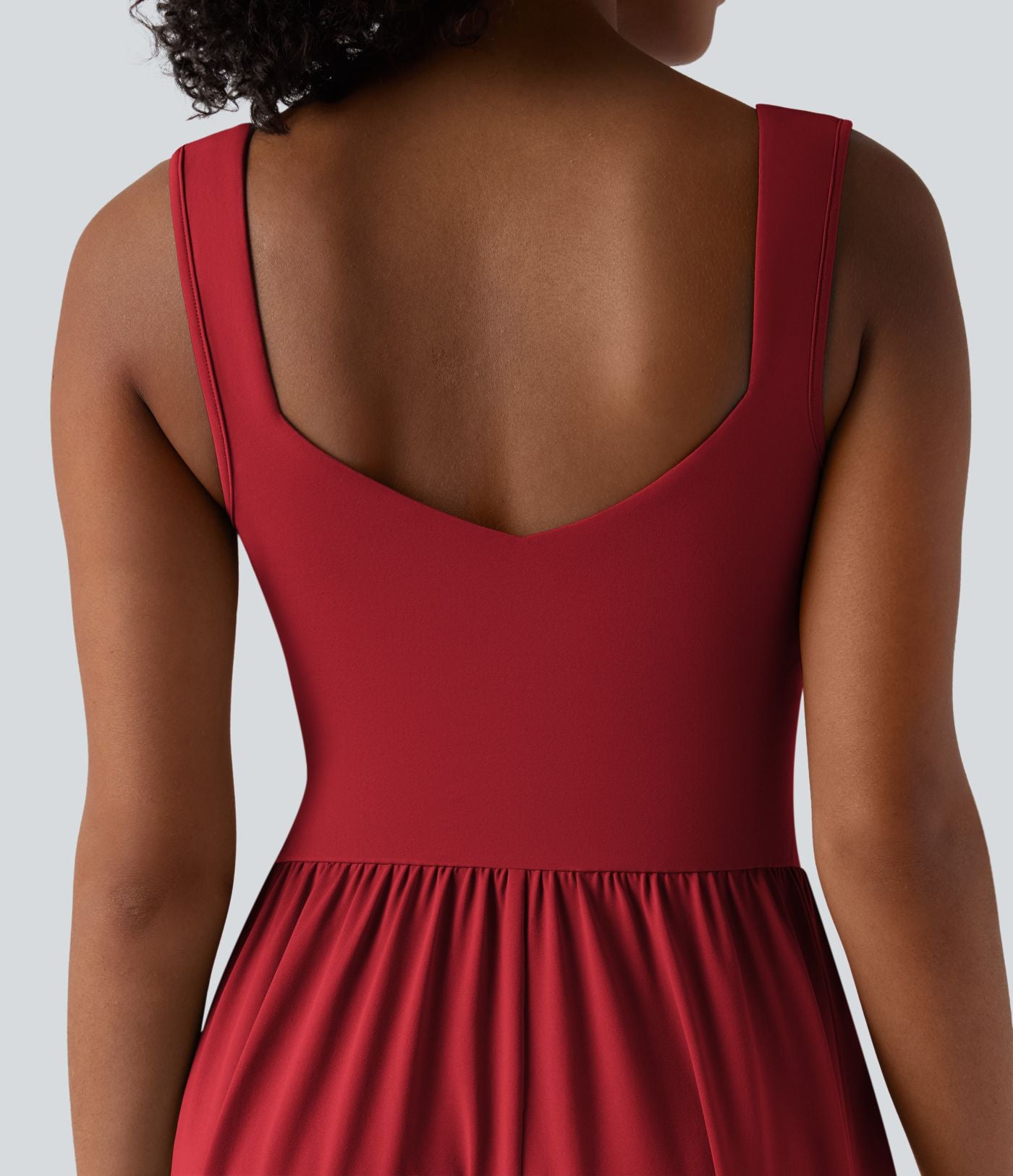 Robe midi fluide sans manches dos croisé ouvert avec poches