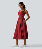 Robe midi fluide sans manches dos croisé ouvert avec poches