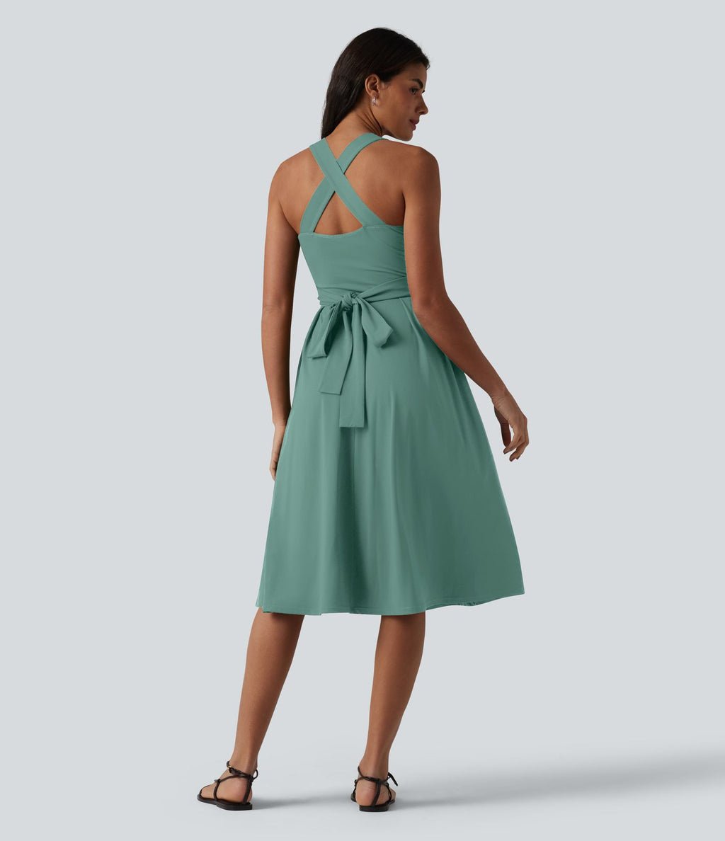 Robe midi fluide sans manches décolleté cœur avec bretelles croisées, nœud dans le dos et poches
