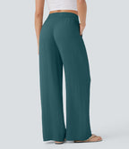 Pantalon large fluide taille haute avec cordon de serrage, poches latérales et aspect lin