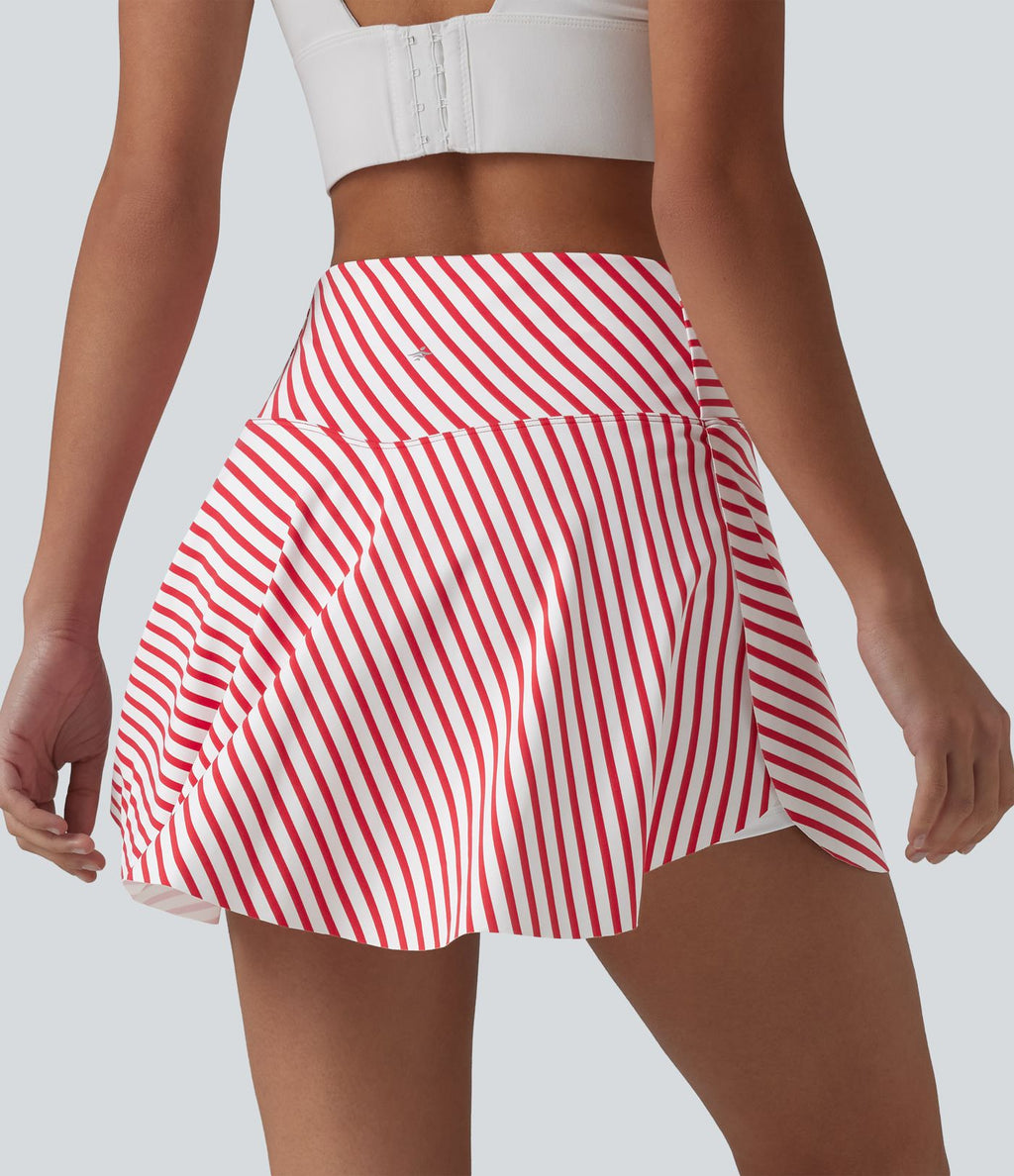Jupe de tennis mini 2 en 1 à rayures, taille haute croisée, ourlet arrondi et poches