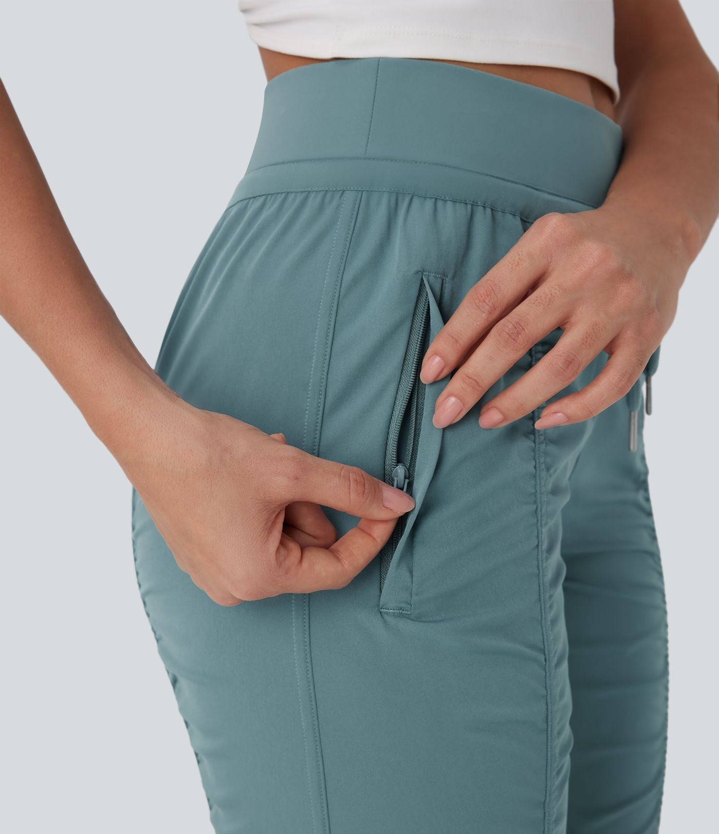 Pantalon jogging de voyage taille haute avec cordon de serrage, coupe fuselée et poches latérales zippées