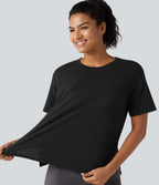 Haut de sport en coton col rond à manches courtes, ourlet fendu et coupe ample pour le yoga