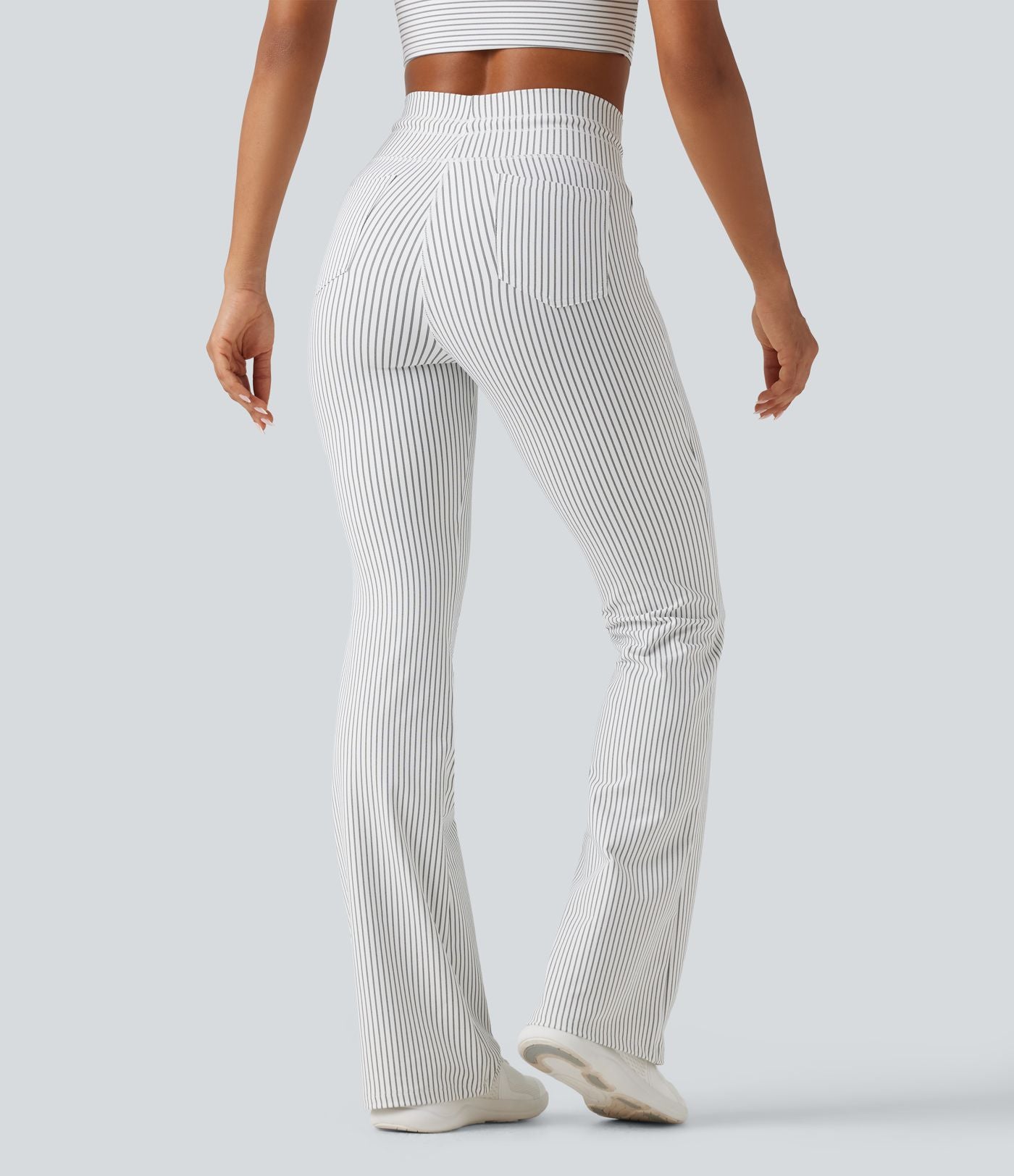 Pantalon de yoga flare taille haute rayé avec cordon de serrage et poches