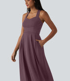 Robe midi fluide sans manches décolleté cœur avec bretelles croisées, nœud dans le dos et poches