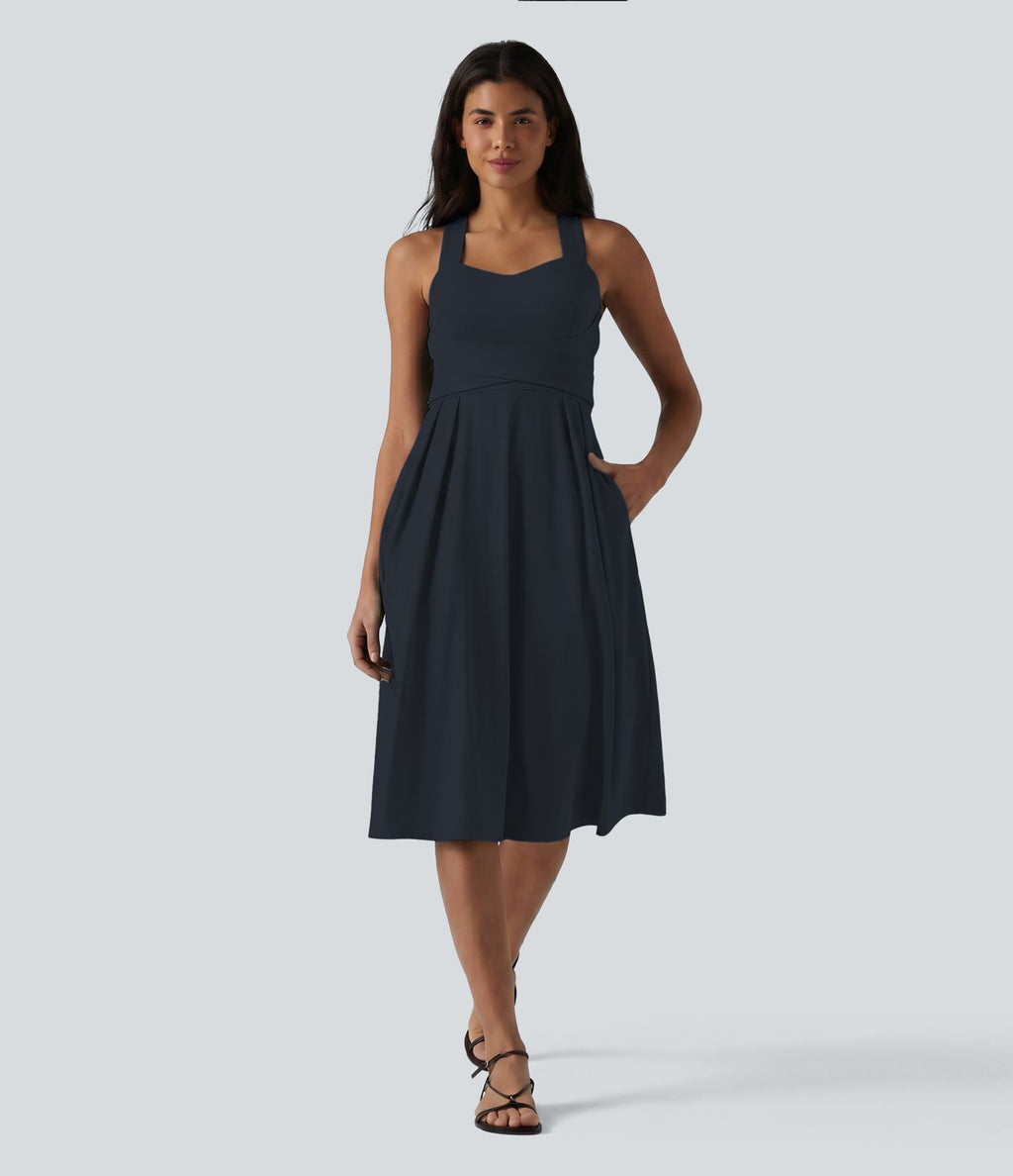 Robe midi fluide sans manches décolleté cœur avec bretelles croisées, nœud dans le dos et poches