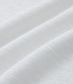 T-shirt décontracté semi-transparent une épaule dénudée à manches longues et ourlet asymétrique