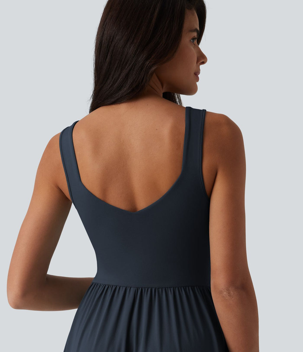 Robe midi fluide sans manches dos croisé, avec brassière intégrée (Bonnets E-G) et poches