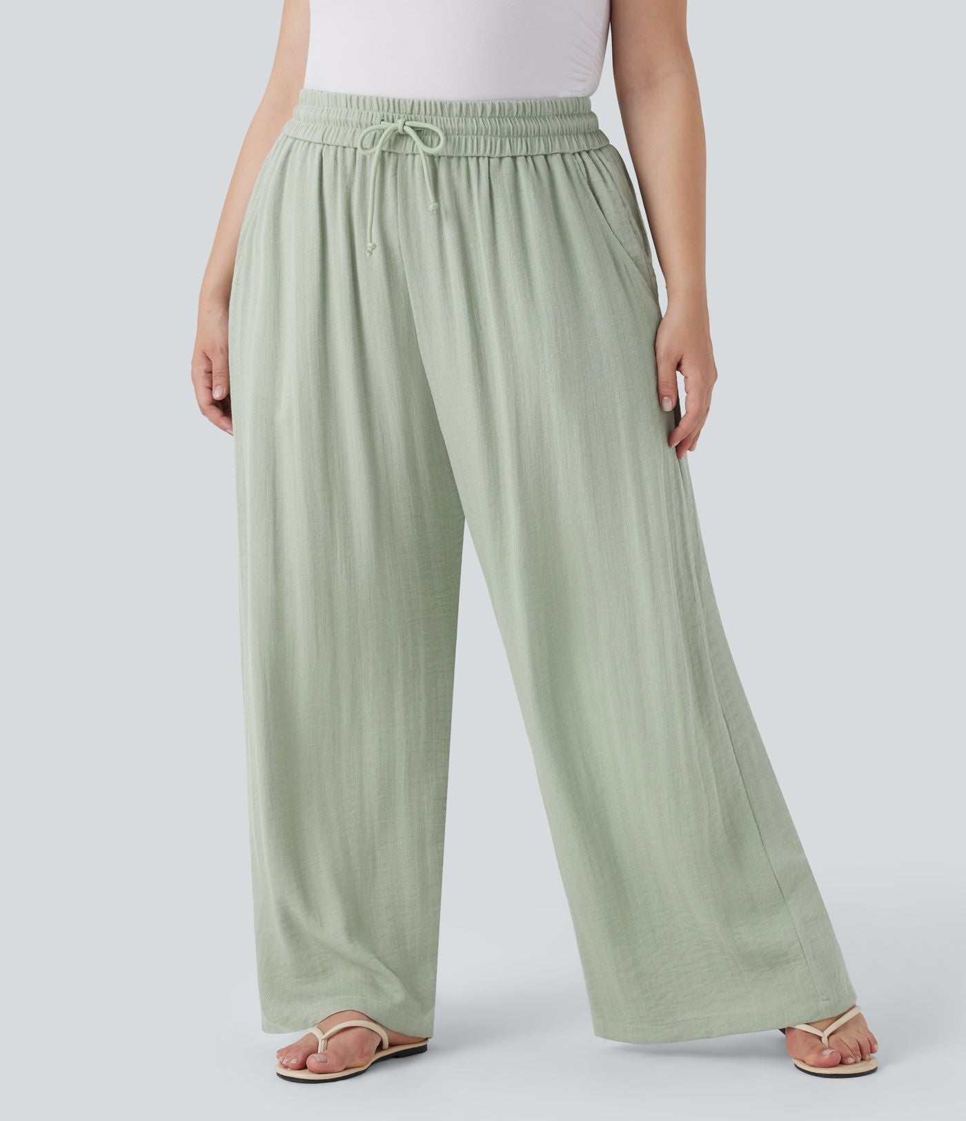 Pantalon décontracté grande taille large fluide taille haute effet lin avec cordon de serrage et poches