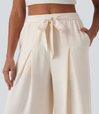 Pantalon large resort taille haute aspect lin avec nœud frontal et poches - Short intégré