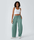 Pantalon Large Fluide Taille Mi-Haute Taille Élastique Cordon Poches Latérales Ourlet Flottant