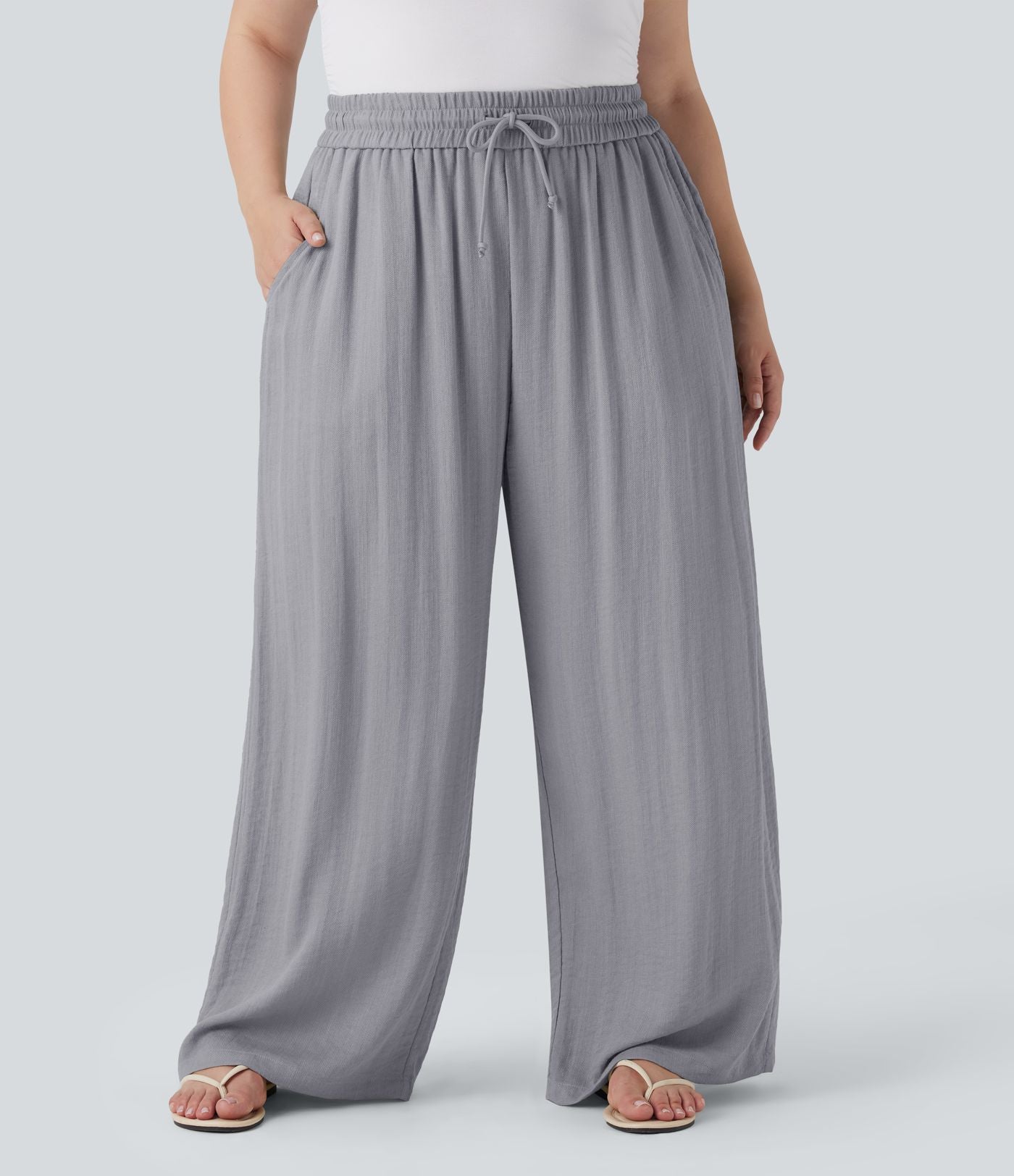 Pantalon décontracté grande taille large fluide taille haute effet lin avec cordon de serrage et poches