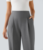 Pantalon tailleur taille haute froncé coupe fuselée avec poches et fermeture éclair invisible sur le côté