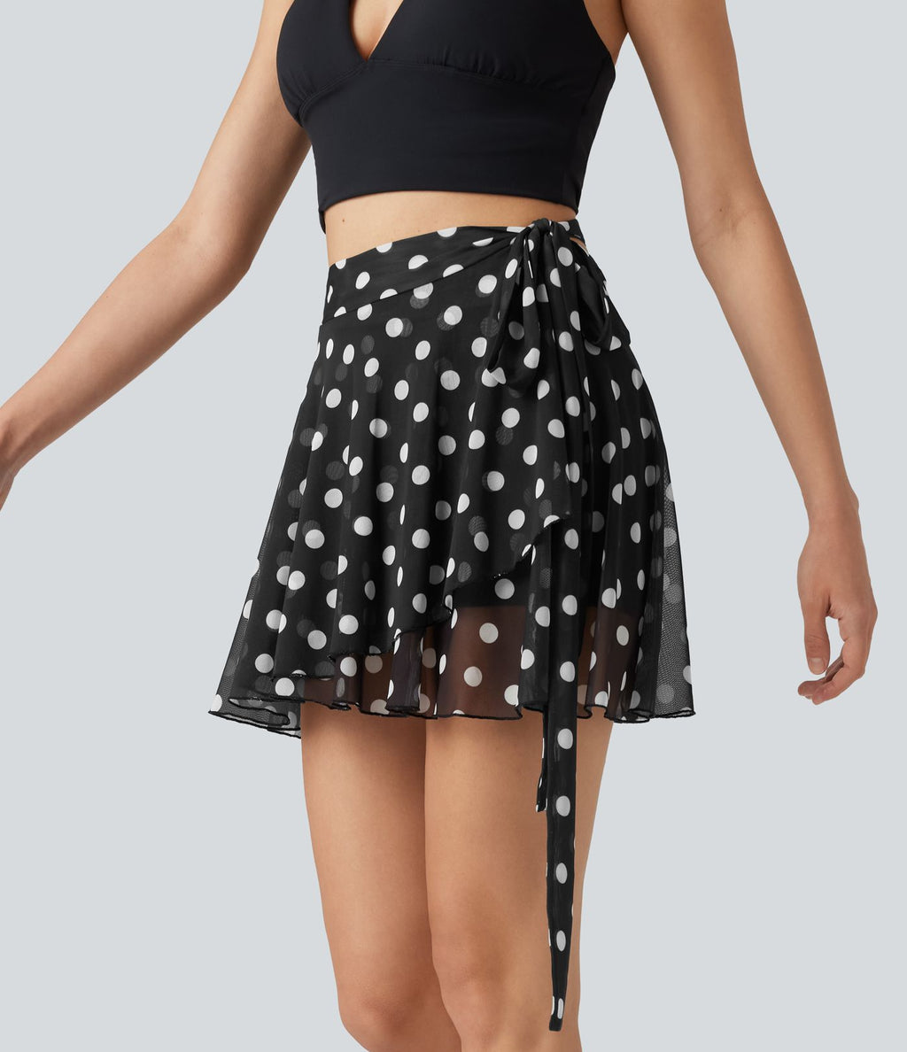 Jupe évasée micro-mini en maille à pois, taille haute, à nouer sur le côté et poche
