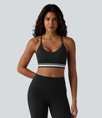 Brassière de sport SoftlyZero™ Plush à maintien léger, dos croisé ouvert, rayures color block et soutien intégré