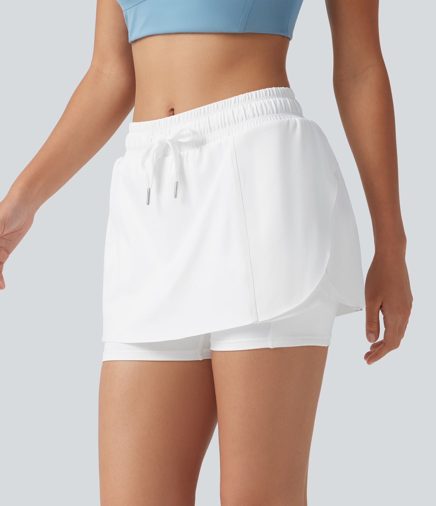 Jupe-short de sport mini SoftlyZero™ Airy taille mi-haute à ourlet croisé, toucher frais, cordon ajustable et poches