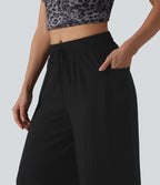 Pantalon ample décontracté à taille mi-haute, fentes, aspect lin, cordon de serrage et poches