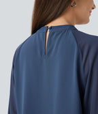 Blouse de travail à col montant avec dos ajouré, manches raglan et empiècements en mesh contrastant