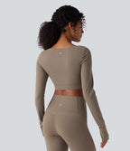 Halara UltraSculpt™ Top court de sport push-up à manches longues avec passants pouces et ourlet croisé