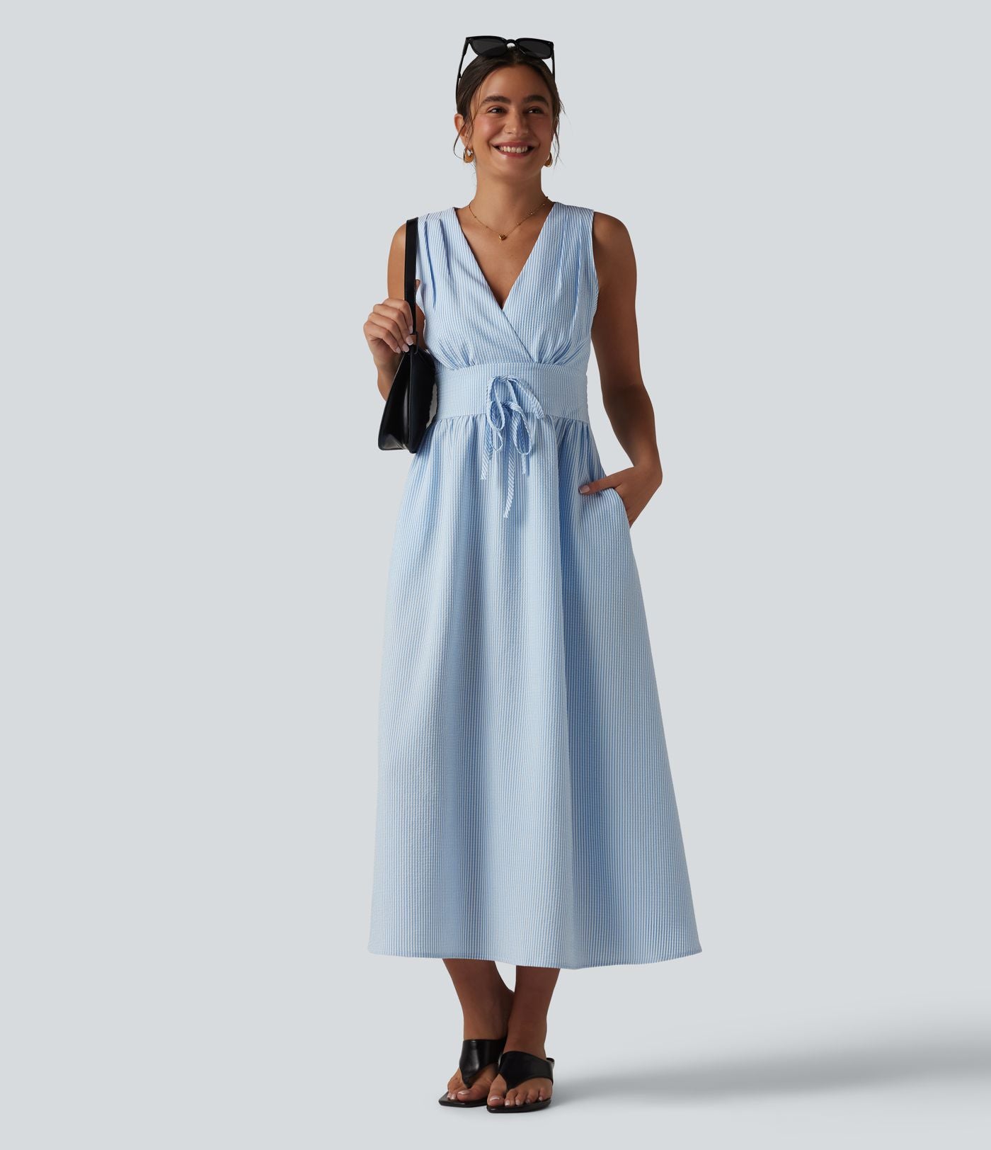 Robe midi rayée sans manches à col en V et poches