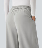Pantalon tailleur large taille haute croisée avec poches