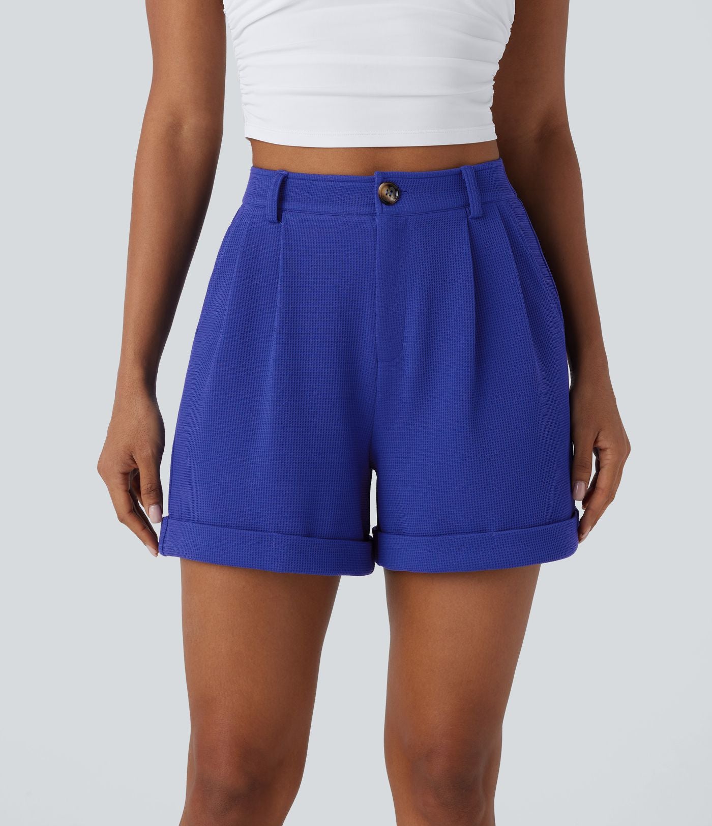 Short décontracté gaufré à taille haute, fermeture zippée, bouton et poches latérales