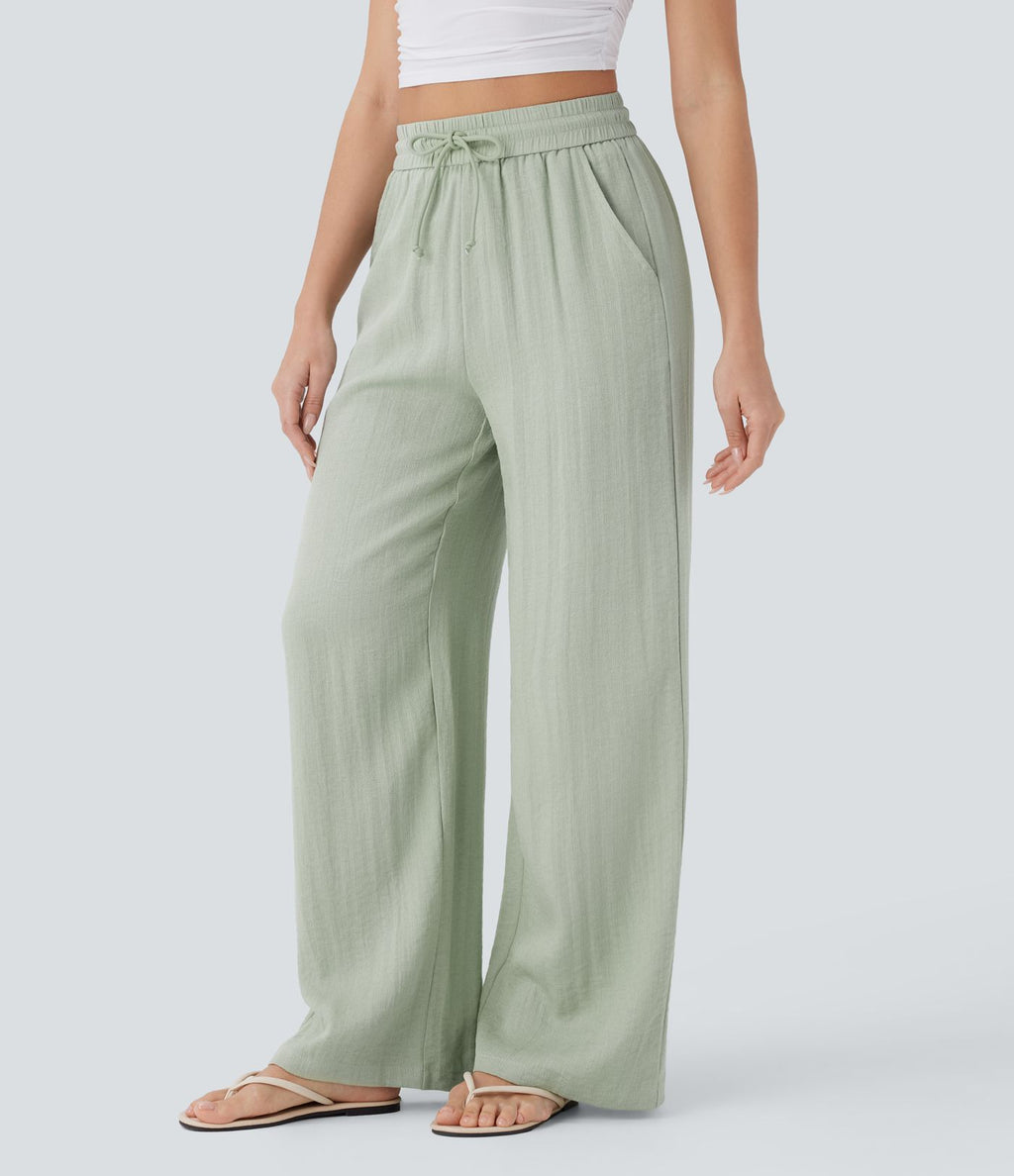 Pantalon large fluide taille haute avec cordon de serrage, poches latérales et aspect lin