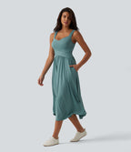 Robe midi fluide sans manches dos croisé, avec brassière intégrée (Bonnets E-G) et poches