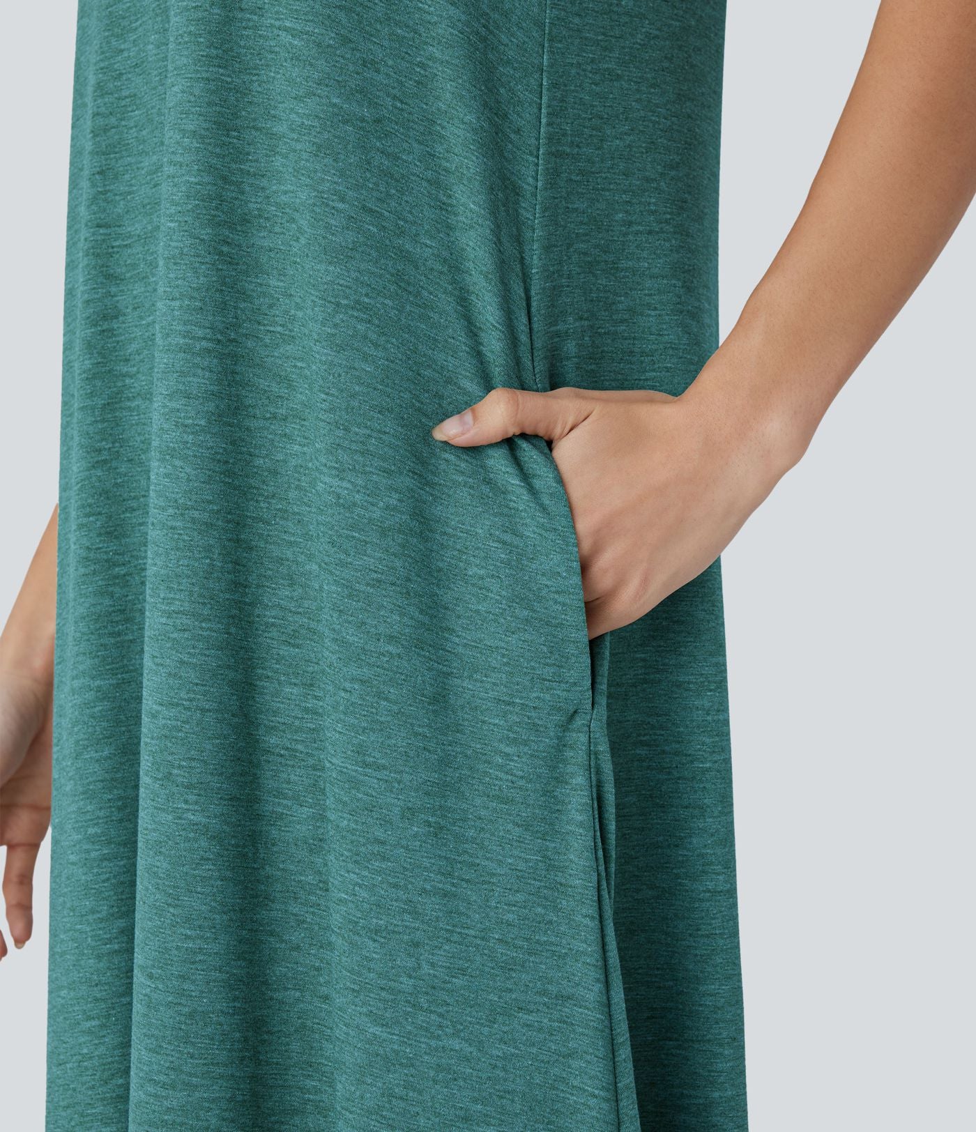 Robe longue décontractée fluide à col rond, sans manches, poches latérales et ourlet asymétrique